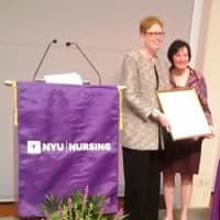 <p>Feldman receives her award from New York University. </p>