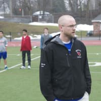 <p>Greenwich Head Coach Mike McSherry works with his team during a recent practice.</p>