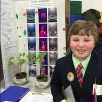 <p>A student showcases his project at the STEMFest. </p>