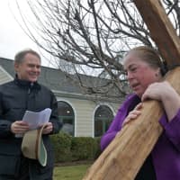 <p>Walkers carry the cross from the First Congregational Church to St. Luke Episcopal on Good Friday.</p>