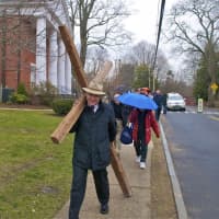 <p>The Rev. Dale Rosenberger leads off the Cross Walk in Darien on Good Friday.</p>
