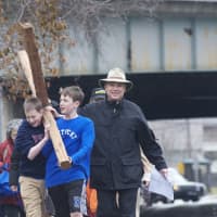 <p>Alex Armstrong (L), 12, and Owen Sheed, 13, of Darien, take a turn carrying the heavy cross.</p>