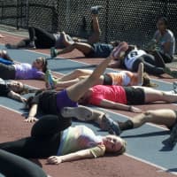 <p>The Hatters do stretching during practice.</p>
