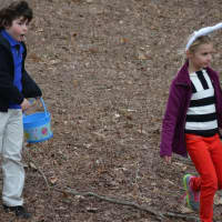 <p>Seven-year-old Finn Nestor, Weston, Conn., and eight-year-old Olivia Wrubel, Chappaqua, head down a hill after participating in the Chappaqua Fire Department&#x27;s egg hunt.</p>