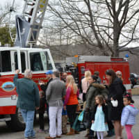 <p>People line up by a Chappaqua firetruck as an Easter egg hunt winds down.</p>