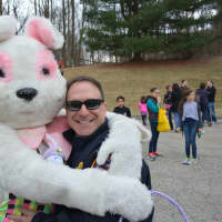 <p>Chappaqua Fire Chief Russell Maitland with an Easter bunny.</p>