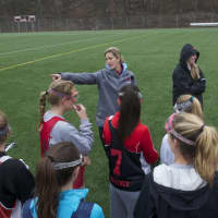 <p>Greenwich Head Coach Caitlin Young talks to her team. </p>