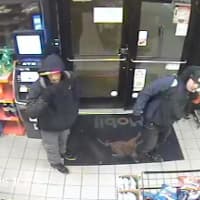 <p>Surveillance footage showing two suspects in a Norwalk car burglary where a wallet and credit cards were stolen.</p>