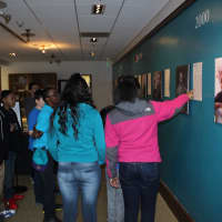 <p>Beardley School students interact with the &quot;Special Collections&quot; exhibition in a free school tour in Pequot Library&#x27;s Perkin Gallery.</p>