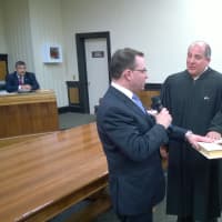 <p>Dennis Pilla, left, was sworn in as mayor of Port Chester on Tuesday evening at Village Hall by Judge  Judge Anthony Provenzano. Pilla was joined by his wife, Margoth, at the ceremony.  </p>