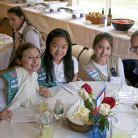 <p>Girls Scouts sit down for lunch with town officials. </p>