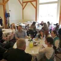 <p>The Girl Scouts enjoy lunch with town officials.</p>