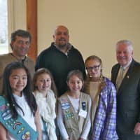 <p>Carlos Menteiro (back left), of the Public Works Department, Jeff Minder (back center), the Town Tree Warden, and Fairfield First Selectman Michael Tetreau enjoy lunch with the Girl Scouts.</p>