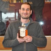 <p>Erik Wolfe, owner of Bomberger&#x27;s Whiskey, showcasing his product. </p>
