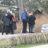 <p>Mourners console each other at Lacey Carr&#x27;s wake.</p>