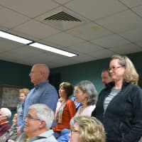 <p>North Castle Historical Society trustees stand after Sharon Tomback asks them to do so.</p>