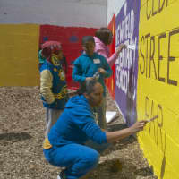 <p>Students paint murals at the Cedar Street Park in Stamford.</p>