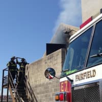 <p>Fairfield firefighters conduct an exercise Monday at the Joseph Elias Training Fire Training Center. </p>
