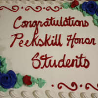 <p>Students were treated to a cake after the ceremony. </p>