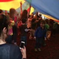 <p>At the end of the workshop, children were treated to a huge parachute to go under and dance inside of. </p>