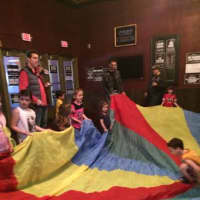 <p>The parachute at the end of the performance thrilled the children. </p>
