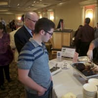 <p>Chris, owner of Northern Smoke BBQ, hands out samples. </p>