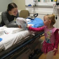 <p>A member of the NWH Emergency Department team shows a young child what the department is all about.</p>