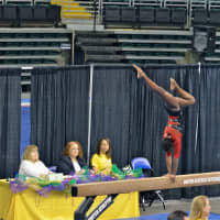 <p>Carlee Reeid performs on the balance beam during a competition in St. Louis.</p>