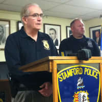 <p>Sgt. Anthony &quot;Butch&quot; Lupinacci speaks at the press conference announcing the arrest of two men in a murder investigation, At right is officer Eddie Davis.</p>