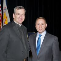 <p>Father Tom Collins, President of Stepinac, welcomes Westchester County Executive Rob Astorino (R).</p>