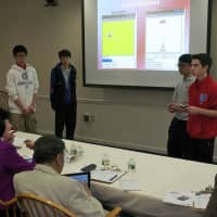 <p>Students present their work to a panel of judges.</p>