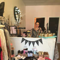 <p>Mamaroneck resident Kristen Carelli behind the counter at Katules.</p>