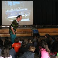 <p>David Johnson, who runs the Walk Through East Africa program, presents Kenyan practices to the students. </p>