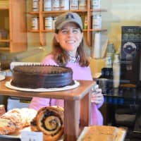 <p>Behind the treats counter at Ross&#x27; Bread is new owner Amy Freidenrich. </p>