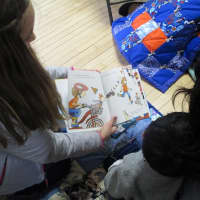 <p>Students read to young children on April 10 at FCAs Literacy Day.</p>