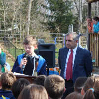 <p>Royle Student Council President Lucas Smith, along with Principal John Grasso, give remarks at the dedication ceremony.</p>