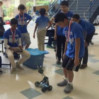 <p>Aniruddha Murali demonstrates a robot that he will use in the RoboCross event at the National Science Olympiad.</p>