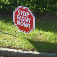<p>Signs protesting the proposed FASNY school dot stretches of North Street (Route 127) near White Plains High School.</p>