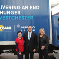 <p>From left, Bonnie Koff, Arif Boysan, general manager of Bloomingdales in White plains, and Ellen Lynch, president and CEO of the Food Bank for Westchester in front of a Food Bank truck at the Bloomingdales in White Plains.</p>