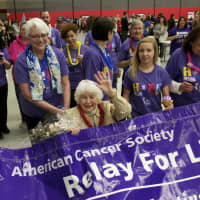 <p>Dorothy Holland, a 50-year cancer survivor, beams as she leads the parade of survivors at Friday&#x27;s Relay for Life at Sacred Heart University in Fairfield.</p>