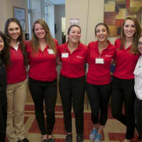 <p>The Watermark&#x27;s Cindy McGuire, left, an event organizer, poses with some of the students. </p>