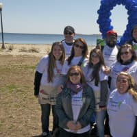 <p>Walkers hit the beach on cool but sunny day at Calf Pasture in Norwalk. </p>