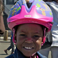 <p>Kids are all smiles after getting their new helmets. </p>