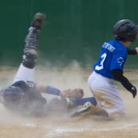 <p>Jakob Berger of the Dodgers is safe at home, as Yankees catcher AJ Rodrigues applies tag.</p>
