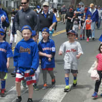 <p>The Little League parade heads down Noroton Avenue on Sunday.</p>