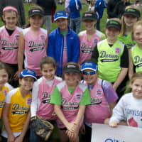 <p>Softball players gather together during the opening ceremonies. </p>