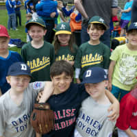 <p>Little League players pose with friends. </p>