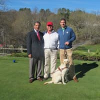 <p>Al Maiolo, center, with Mount Kisco Country Club general manager Hussein Ali, left, head golf pro Chris Case and Guiding Eyes dog Darien.</p>