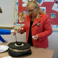 <p>Briarcliff Middle School French student learns ow to make crepes.</p>
