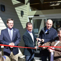 <p>A ribbon cutting is held for the Lewisboro Library as part of its reopening following a massive renovation.</p>